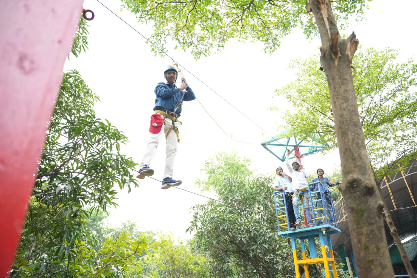 Colleague on the zip-line during an adventure team activity